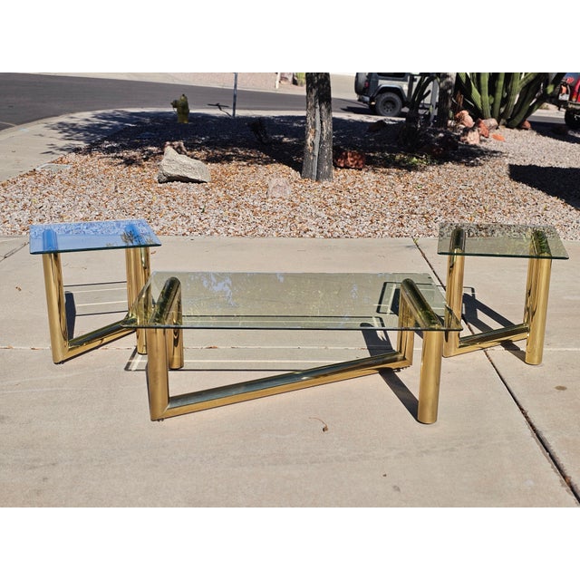 Vintage zigzag brass and glass coffee table designed in the manner of Karl Springer. A fun shape and style for your modern...