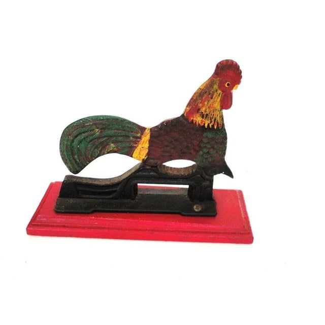 Fantastic and very folky miniature early 20thc original painted rooster nut cracker on the original red painted wood...