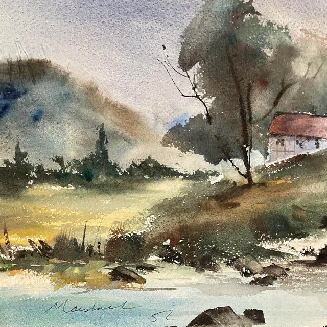 1952 watercolor on paper of a house beside a stream or river, signed and dated "Marshal '52" lower left. Combined shipping...