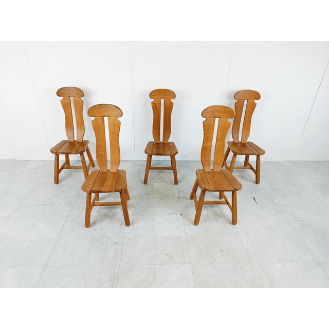 Sturdy and handcrafted dining chairs produced by Depuydt Kunstmeubelen in Belgium. The chairs are made from solid oak....