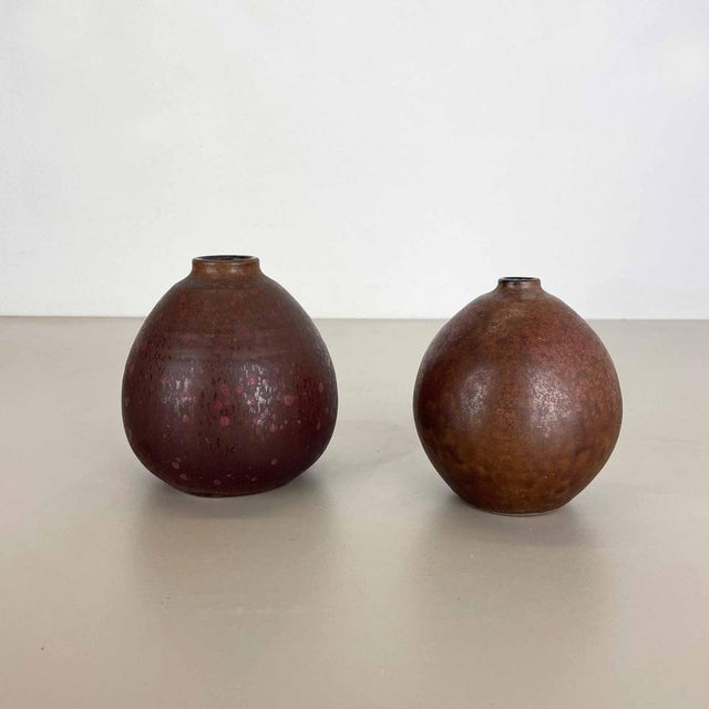 Article: Ceramic vases set of 2. Producer: Elmar & Elke Kubicek , Germany. Decade: 1970s. This original vintage Studio...