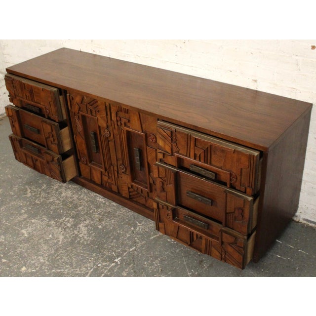 This dresser is from Lane Furniture Co.'s "Pueblo" series. The series brings a splash of brutalism into the mid-century...