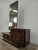 An elegant Art Deco dressing table dating back to the 1940s, featuring a refined walnut frame and a sinuous, geometric...