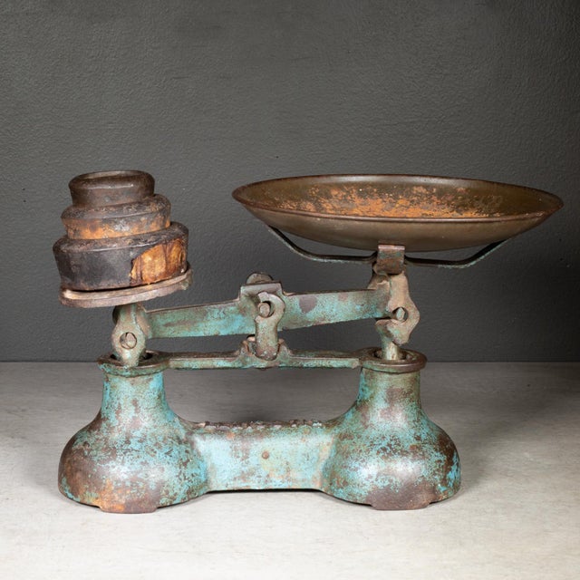 ABOUT A cast iron balance scale with bronze plated dish and embossed maker's mark "Lewis's 7lb". Three original cast iron...