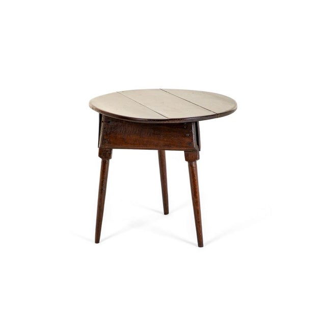 A wonderful 18th century oak cricket table with a rustic weathered three plank circular top. the table is raised on square...