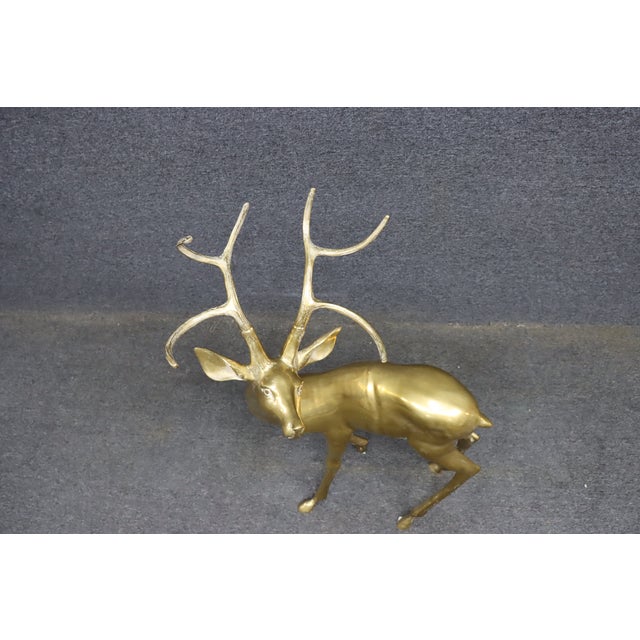 Large vintage brass deer sculpture with graceful lines and a clean, polished look. The form captures a natural stance with...
