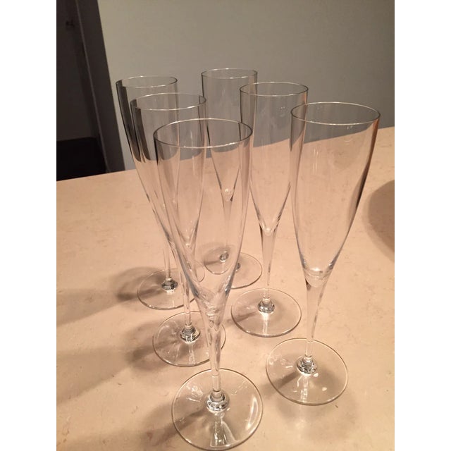 A set of six 1990s Dom Pérignon Baccarat crystal champagne flutes, 9" tall, 5.1 oz capacity, fully leaded crystal, made in...