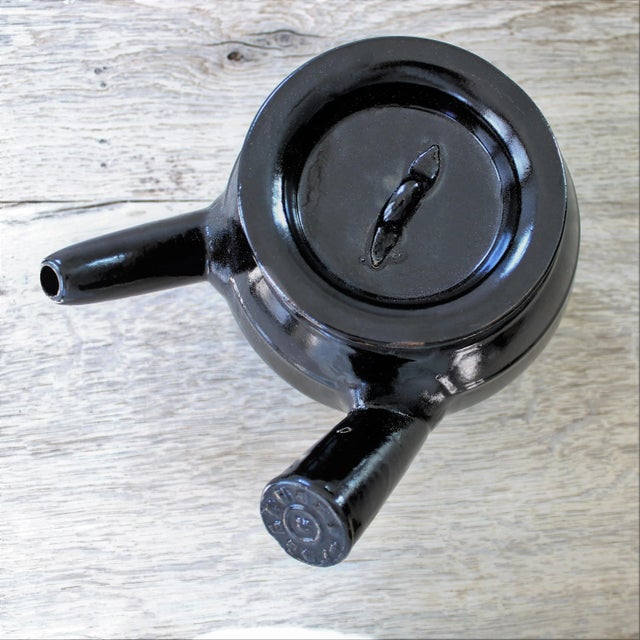 1940's glazed handmade clay teapot from Japan. We love it's unique extended side handle to hold for serving. Too pretty...