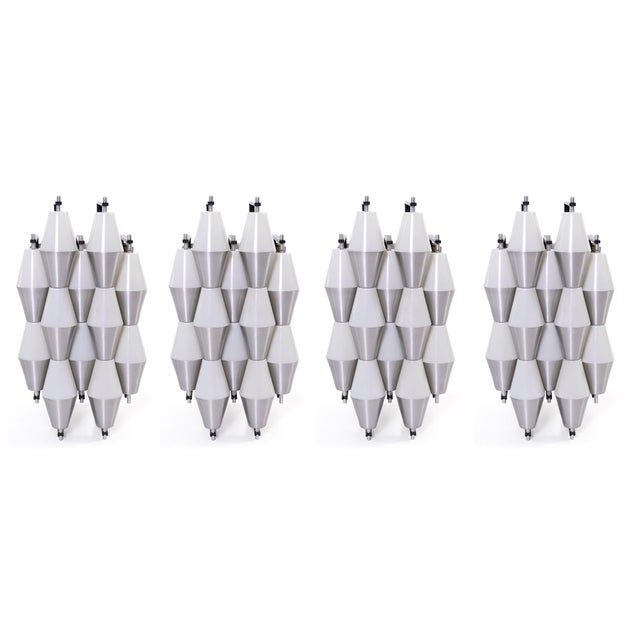Striking and graphic RAAK designed sconces in white and matte aluminum. Price listed is for a pair of sconces. There are...