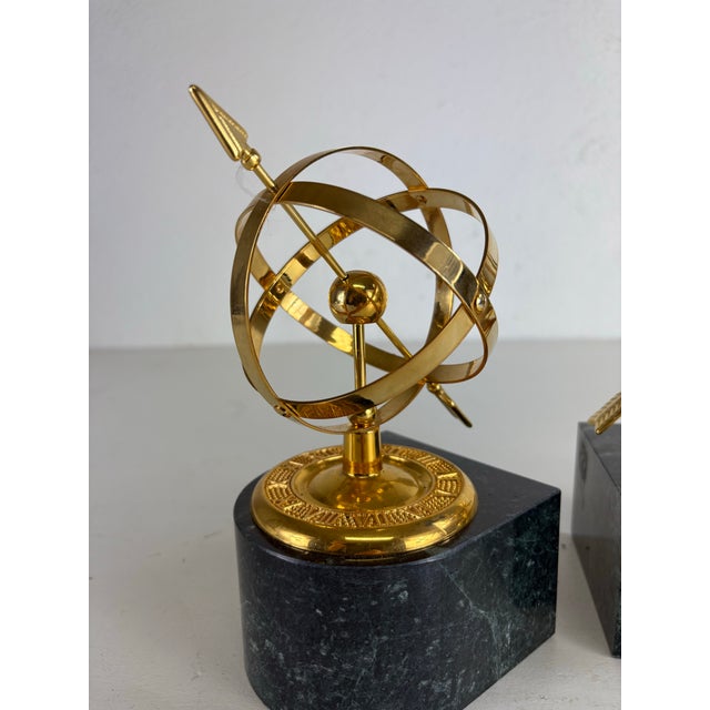 This is a mid-century vintage pair Armillary brass and marble bookends. These bookends have a dark green marble base with...