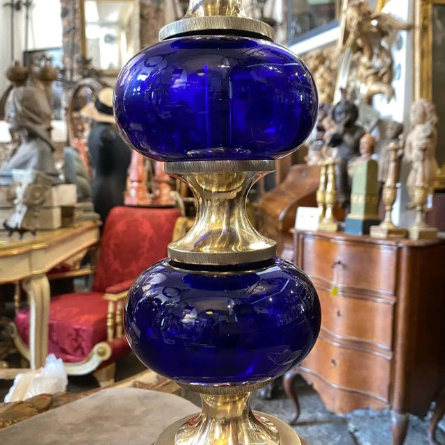 A Gaetano Sciolari B2 table lamp, it's made in Italy by Sciolari Rome in the 1970s, metal and blue round glass spheres are...