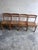 Set of four solid wood dining chairs with a straightforward, rustic construction and an attractive lived-in character....