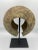 Copper form from the Mbole people of Central Africa. Displayed on a custom metal stand, the piece has a striking modern...