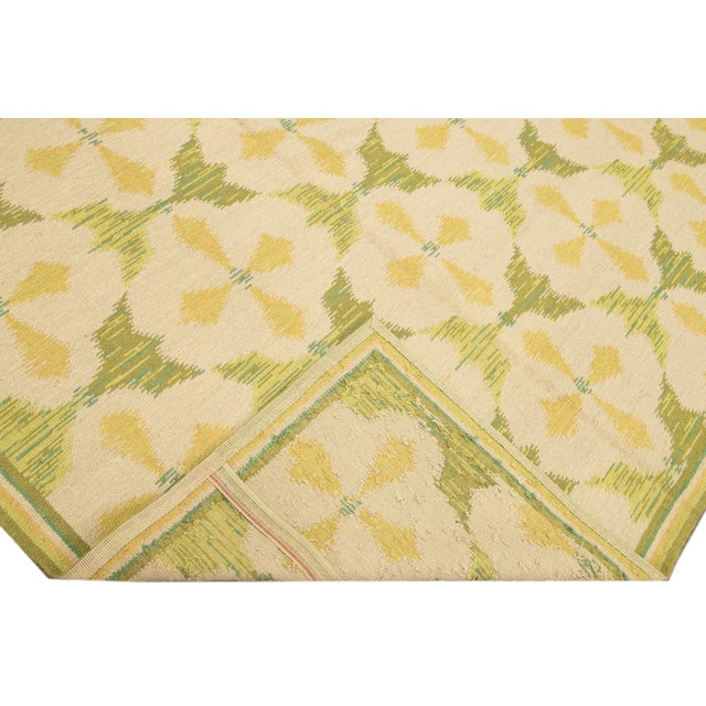 Beautiful Vintage Portuguese Arraiolos needlepoint wool rug with a green field. This piece has fine details in a beige and...