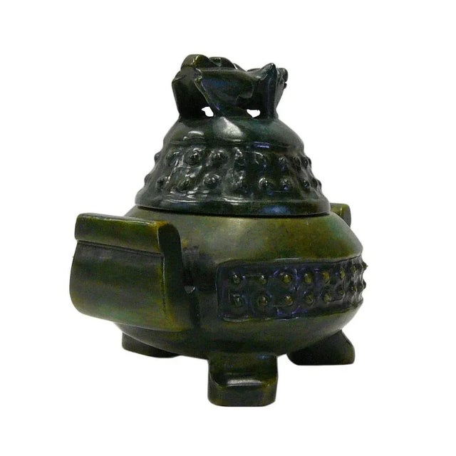This is a nicely carved Chinese incense container with decorative motif and enhanced green stone color as an accent....
