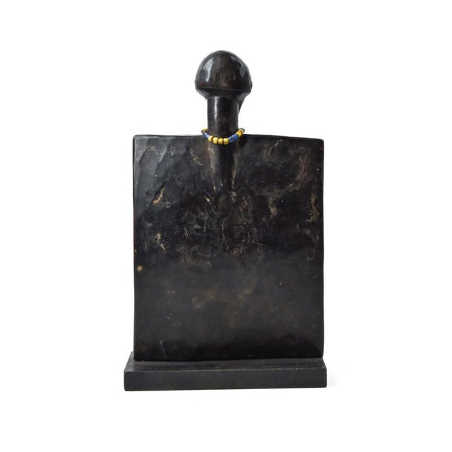 Hand-carved Luba Divination Plank from the Democratic Republic of the Congo. These pieces usually are decorated with beads...