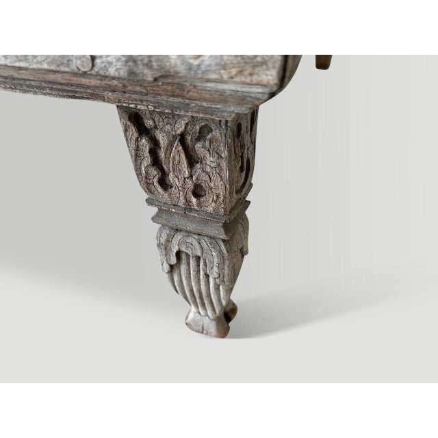 Rare antique teak day bed from the island of Madura. The patina on the wood is stunning. Circa 1900. The length of the arm...
