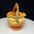 This vintage Weller piece is a unique and charming piece of art pottery. The bowl shape and handle add a practical element...