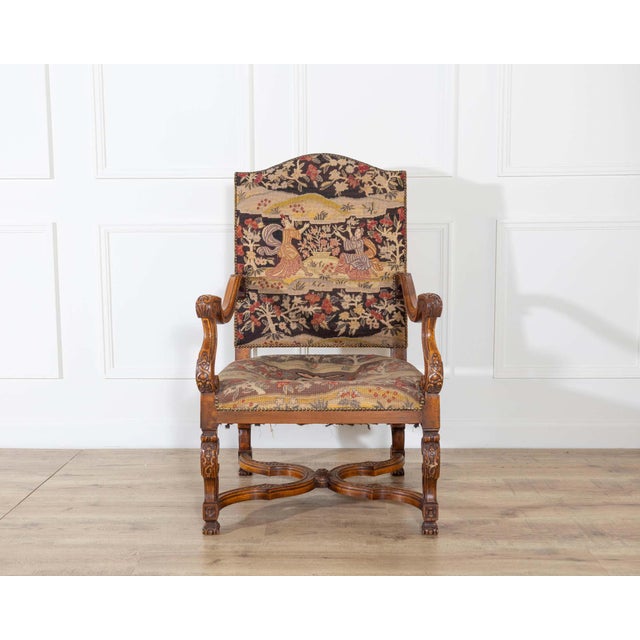 An exceptional Louis XV armchair from Tuscany, crafted in solid walnut during the first half of the 18th century. Entirely...