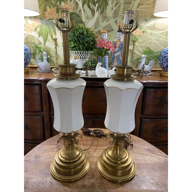 Absolutely lovely pair of vintage Stiffel brass and ceramic tall lamps with decorative key-turn and ornate plume-style...