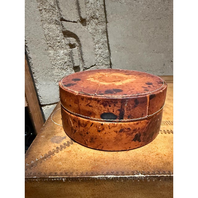 For your consideration, a rustic round lidded box with a mottled brown and black finish, likely constructed from bentwood...