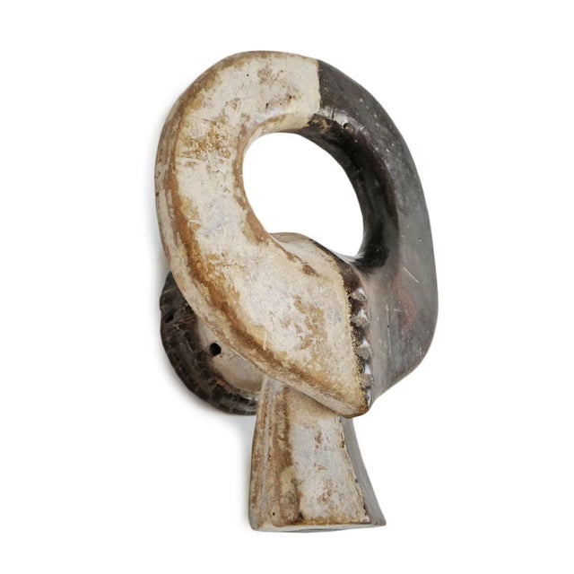 Antique carved wood black and white painted buffalo mask from the Chamba people of Cameroon. The buffalo represents power...