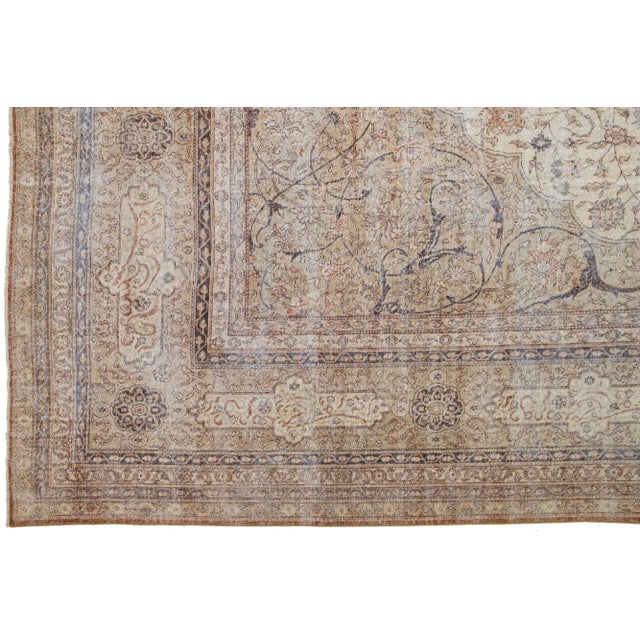 1910s Persian Sivas wool rug, handcrafted, showcases a traditional floral pattern. The contrast between the beige backdrop...