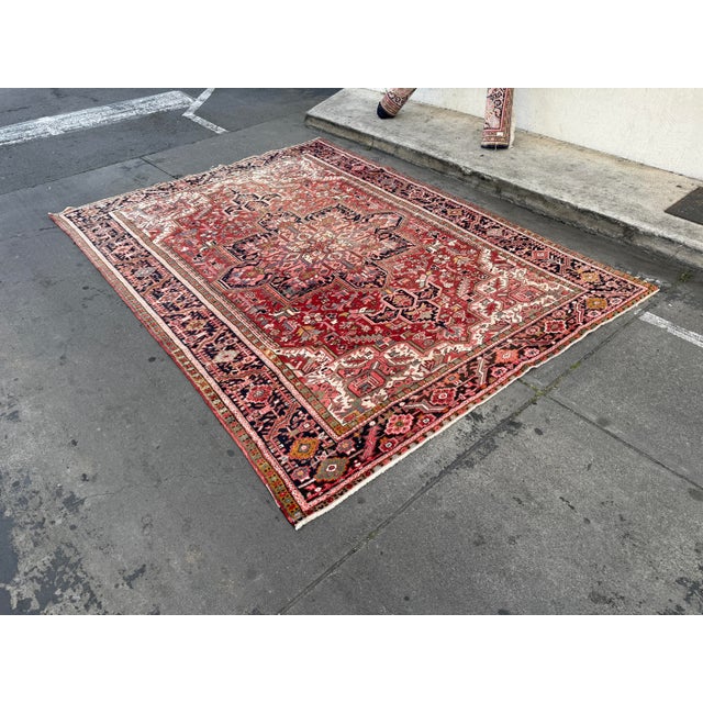Design Plus Gallery presents a 8ft 1in 11ft Heriz Area Rug. The rug crafted from 100% chenille, offering a plush surface...