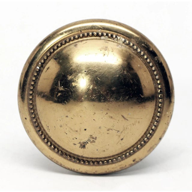Vintage polished brass closet door knob with beaded edging in the middle and bottom of the knob. It is thinner than most...