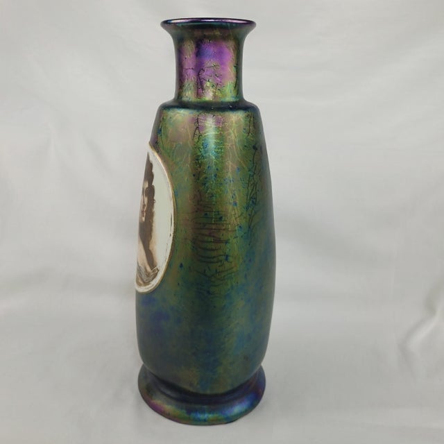 Antique iridescent art glass vase showcases a stunning peacock-inspired oil slick finish with deep blue, green, and purple...