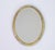 Oval beveled mirror made in Italy in the 60's. The mirror is hand painted with beautiful floral details and gold. The wall...