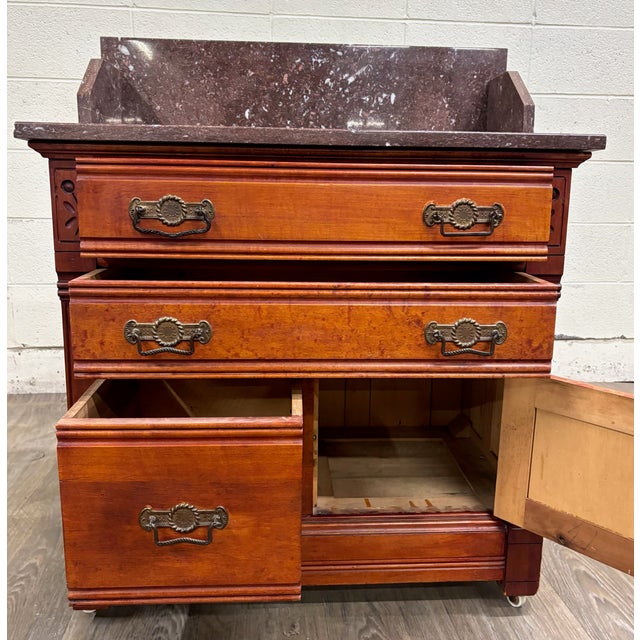 This is a gorgeous antique American Victorian Eastlake marble top chest, nightstand, washstand or commode dating to the...