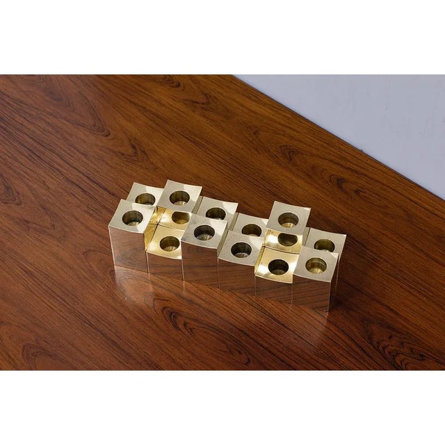 Elegant group of twelve solid brass candlesticks. Manufactured by gusum metallslöjden in sweden during the 1980s. Stamped...