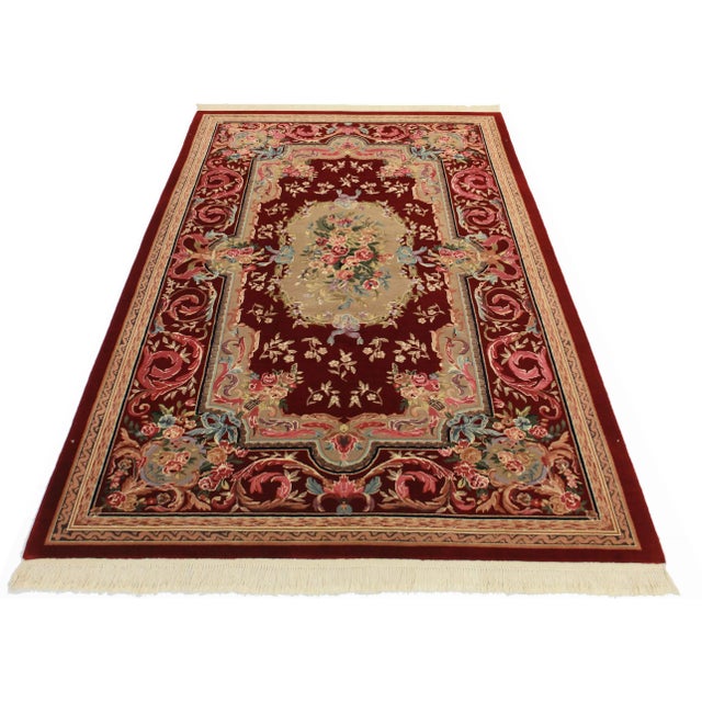 Stunning Chinese rug in brownish reds and berry pinks. Hand-knotted of wool. Features a charming Aubusson design.
