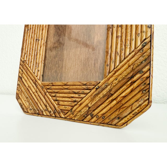 Rare 1970s tabletop picture frame constructed of burnt bamboo and laid in a geometric pattern, with chamfered corner...