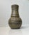 A very rare chamotte clay stoneware vase executed in 'camou' glazes in olive green and brown nuances. We have seen this...