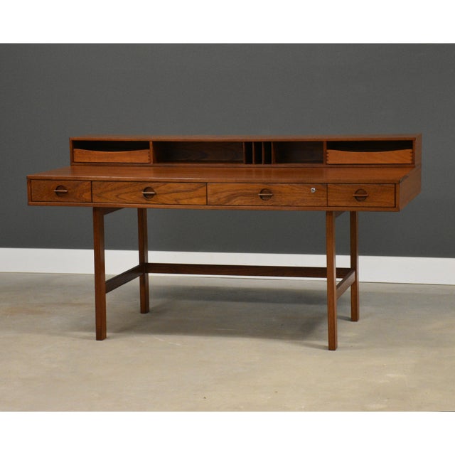 A mid century modern teak flip top desk designed by Peter Løvig signed and dated. Professionally refinished. Dated 1973....