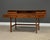 A mid century modern teak flip top desk designed by Peter Løvig signed and dated. Professionally refinished. Dated 1973....
