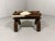 Camel saddle stool. Cowhide covered seat fastened with leather laces on a wooden frame with metal details. 1960-70’s. In...
