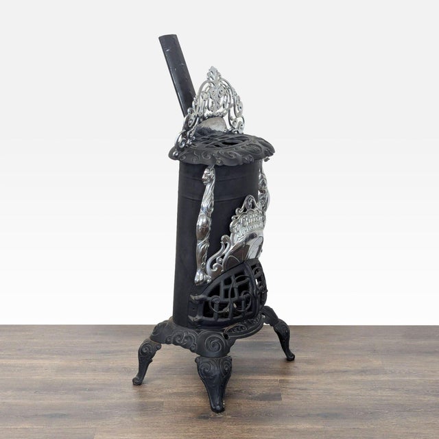 This vintage parlor stove is crafted from durable cast iron with beautiful nickel accents and intricate decorative...