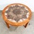 Round ceramic tile coffee table in rosewood. Signed by artist within the tile but it is unreadable. Very simple yet...