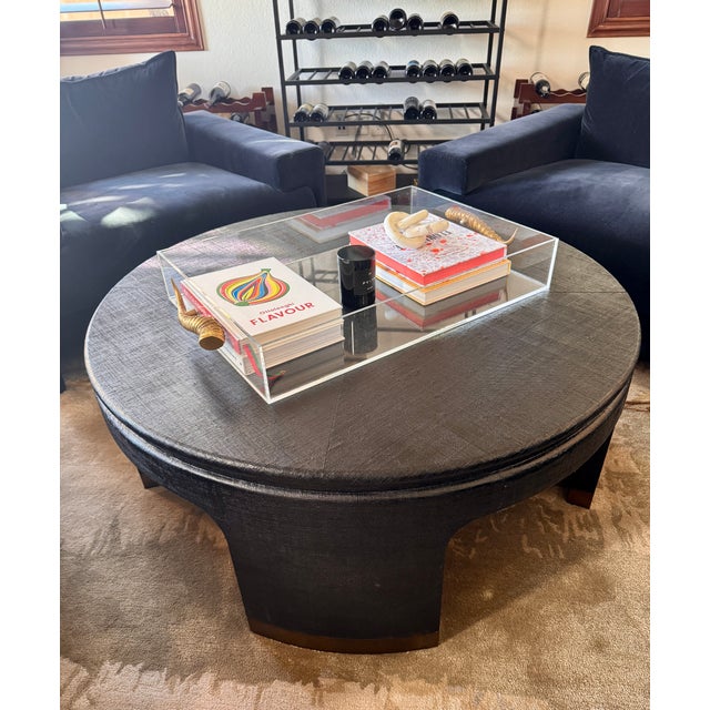 Striking and sculptural, this Bernhardt round coffee table features a richly textured black raffia finish with a bold...