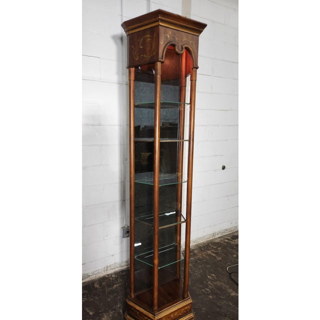 Tall Drexel Heritage corner curio cabinet with an elegant display profile and decorative detailing. Designed to showcase...