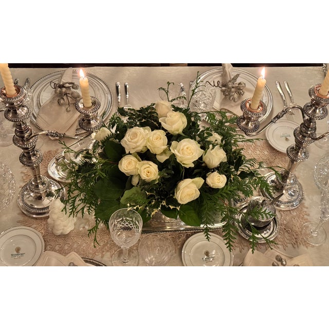 Presenting a pair of English silver plated over copper fancy three arm candleabras. They convert to hold 3 candles or the...