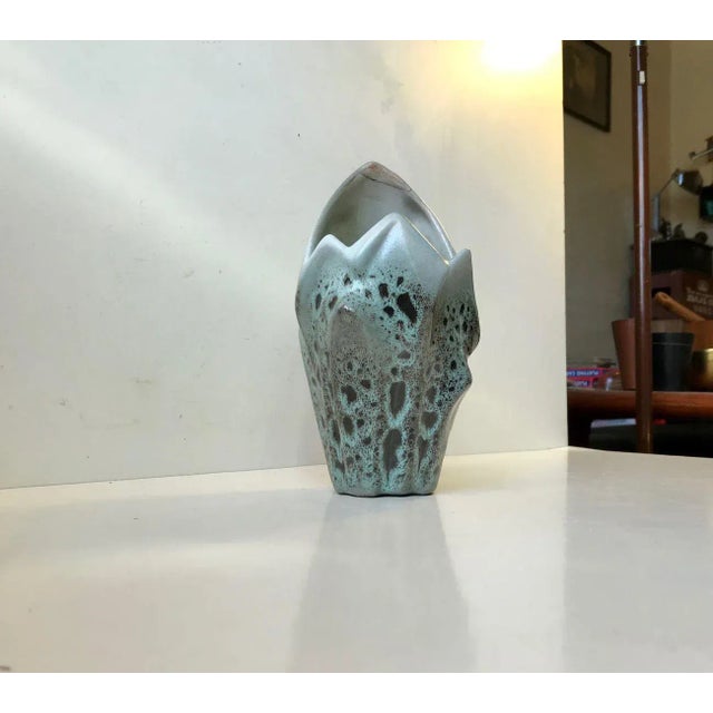 Unique ceramic vase displaying exceptional techniques in glazes, brutalist styling and shape. We have not been able to...