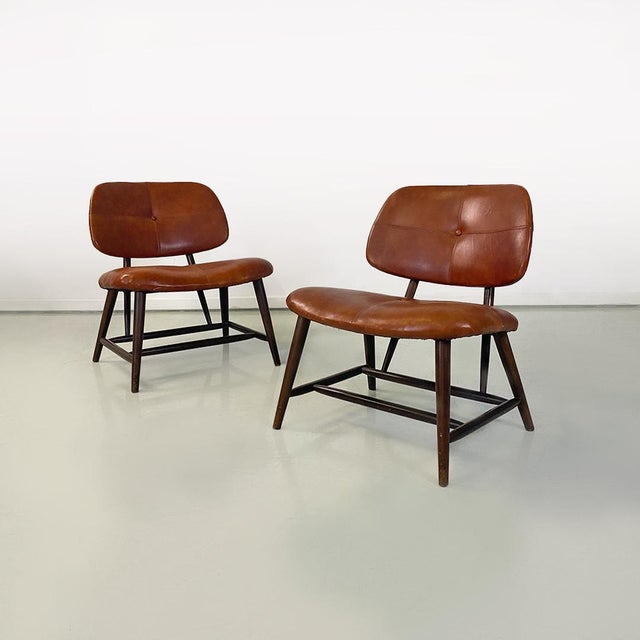 Sweden mid century modern pair of wood and brown leather Teve armchairs by Alf Svensson for Ljungs Industrier AB, 1953....