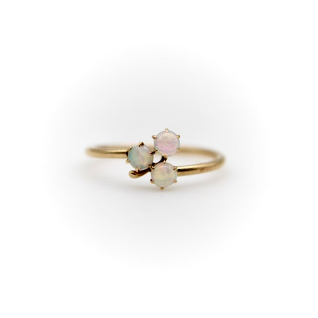 This is a sweet, dainty 14k gold Victorian ring with three opal cabochons that form the shape of a clover. The opals...