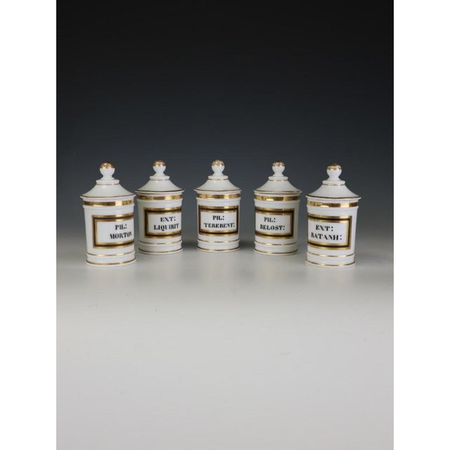 Beautifully proportioned and elegantly understated, this charming set of five late nineteenth-century opaline glass...
