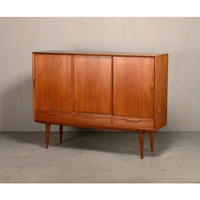 Beautiful sideboard or highboard model 17, designed by Gunni Omann for Omann Jun Møbelfabrik, Denmark, 1960s. A perfect...