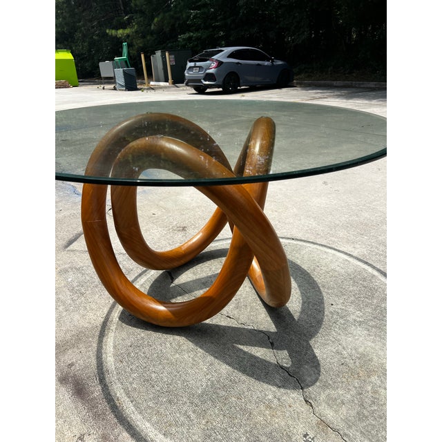 Up for consideration is a beautiful wooden knot dining table with a glass top. This would look lovely in your home, and it...